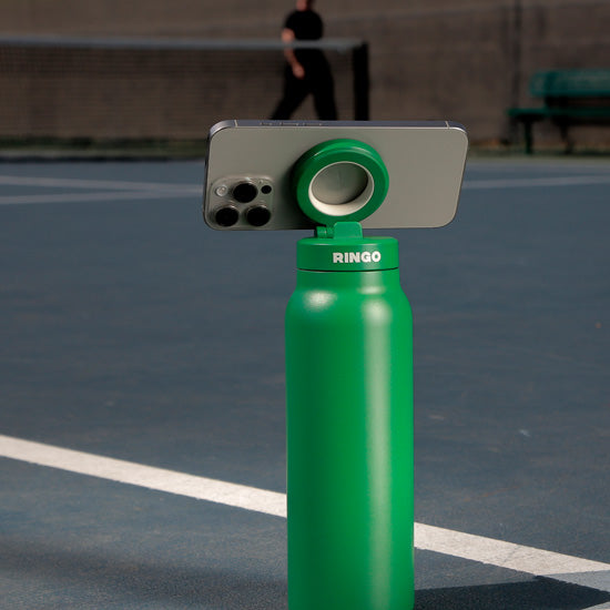 Gourde porte-téléphone Ringo Pro verte à la salle de sport