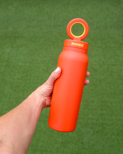 Gourde porte-téléphone Ringo Pro orange à la salle de sport
