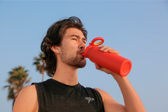 Gourde porte-téléphone Ringo Pro orange à la salle de sport